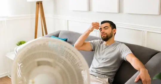 Man cooling down on a couch